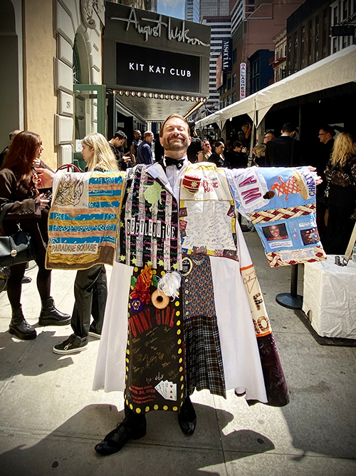 Colin Cunliffe stands wearing the Robe outside the August Wilson Theatre, under the marquis for 'Cabaret'.