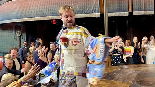 Cunliffe is a blur of motion in the Robe, moving across the stage as the company waits a step down to receive his blessings.