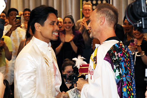 Soriano and Matt Allen, who is still wearing the Robe, face each other and shake hands. Soriano looks thrilled.